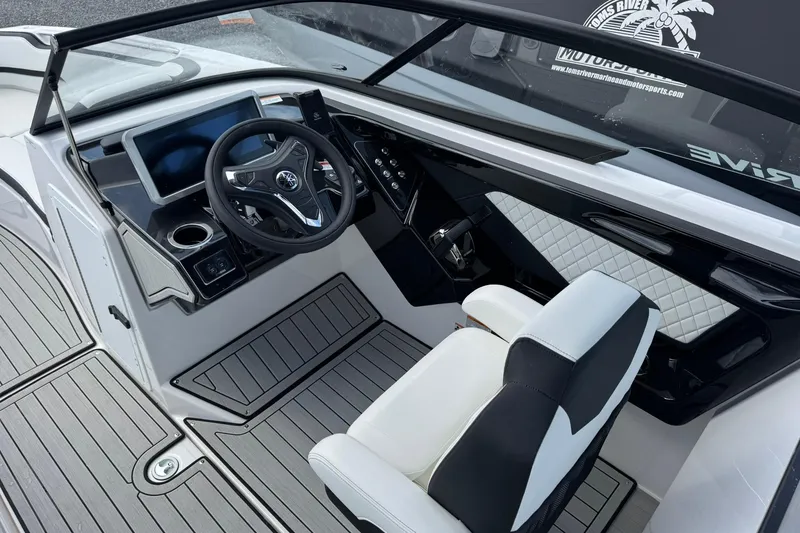 Slide: The Image of 2026 Yamaha Boats 252SD interior with white seating and sleek design. - 11