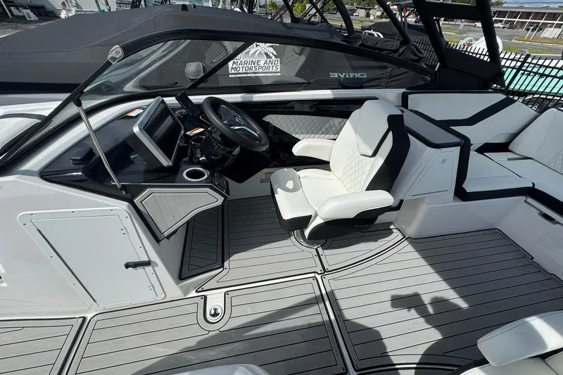 Slide: The Image of Interior of 2026 Yamaha Boats 252SD, featuring sleek dashboard and modern steering wheel. - 12