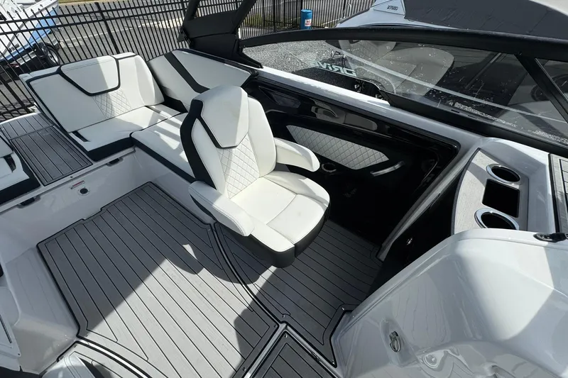 Slide: The Image of Manufacturer Provided Image: 2026 Yamaha Boats 252SD cruising on a serene lake with lush green trees. - 14