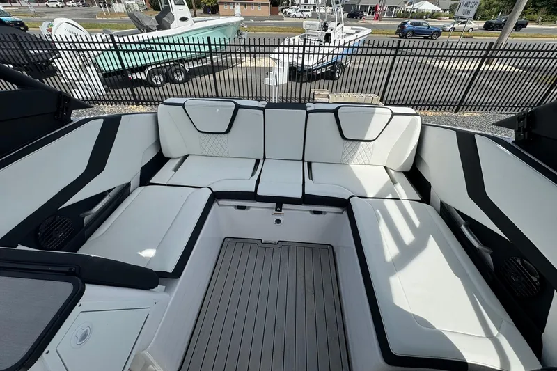 Slide: The Image of 2026 Yamaha Boats 252SD interior with sleek white seating and modern design. - 17