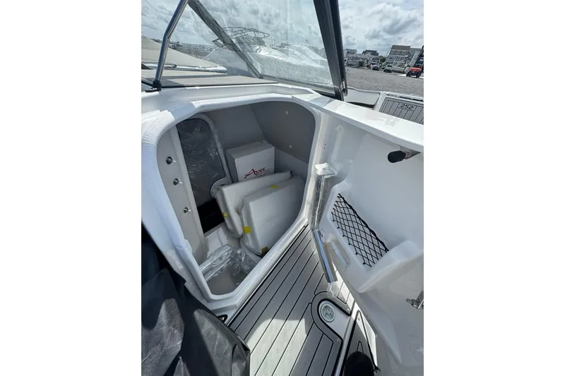 Slide: The Image of 2026 Yamaha Boats 252SD interior with sleek white seating and modern design. - 20