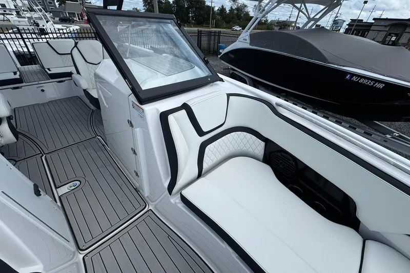 Slide: The Image of Manufacturer Provided Image: 2026 Yamaha Boats 252SD on calm water, sleek design, misty background. - 9