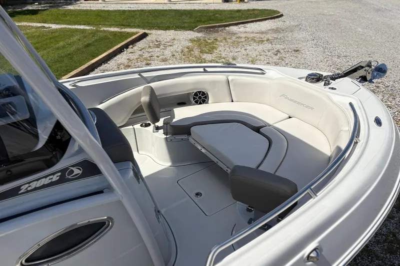 Slide: The Image of 2023 Finseeker 230cc boat interior with cushioned seating and sleek design. - 14