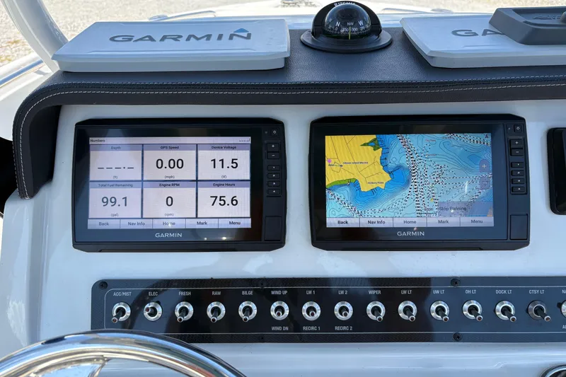 Slide: The Image of Dashboard of 2023 Finseeker 230cc boat with Garmin navigation displays. - 15