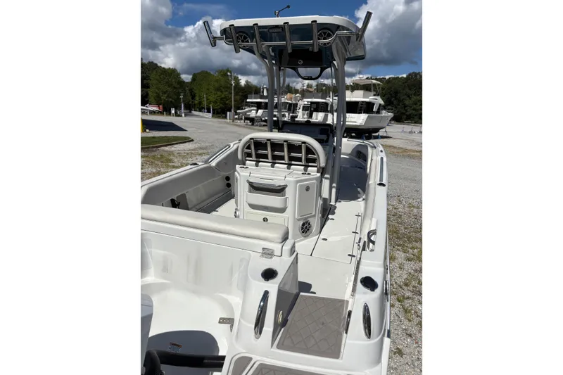 Slide: The Image of 2023 Finseeker 230cc boat with T-top, spacious deck, and modern design. - 7