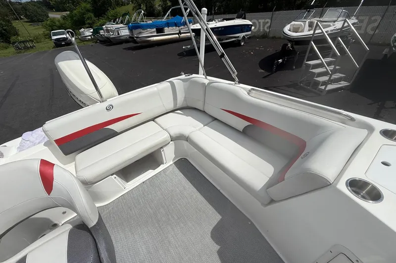 Slide: The Image of 2019 Hurricane SunDeck Sport 188 OB boat interior with white and red seating. - 12
