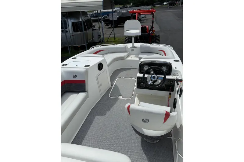 Slide: The Image of 2019 Hurricane SunDeck Sport 188 OB boat interior with seating and steering console. - 6