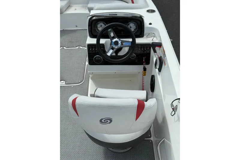 Slide: The Image of 2019 Hurricane SunDeck Sport 188 OB boat cockpit with steering wheel and control panel. - 7
