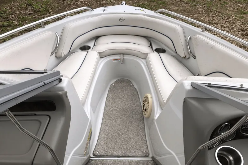 Slide: The Image of 2008 Crownline 19 SS boat interior with white seating and carpeted floor. - 12