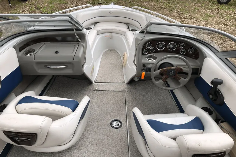 Slide: The Image of 2008 Crownline 19 SS boat interior with steering wheel and seating. - 19