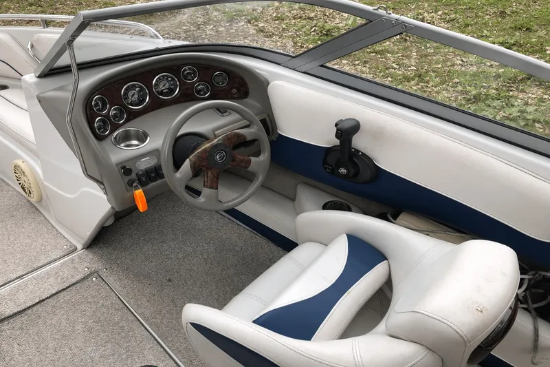 Slide: The Image of 2008 Crownline 19 SS boat interior with steering wheel and dashboard controls. - 20