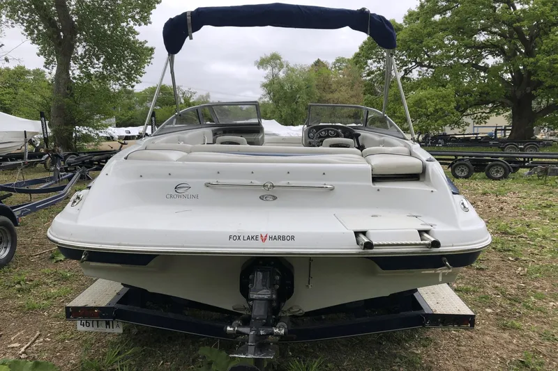 Slide: The Image of 2008 Crownline 19 SS boat on trailer, rear view, parked outdoors. - 28