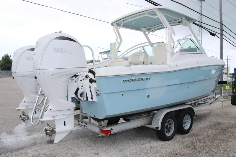 Slide: The Image of 2026 World Cat 230 DC boat on trailer with twin Yamaha outboard engines. - 3