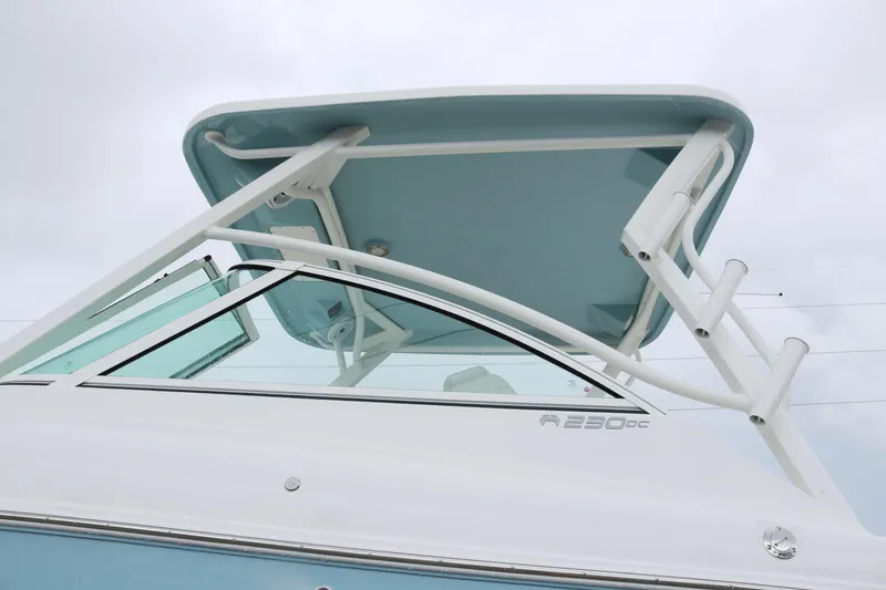 Slide: The Image of 2026 World Cat 230 DC boat with sleek design and modern features. - 5