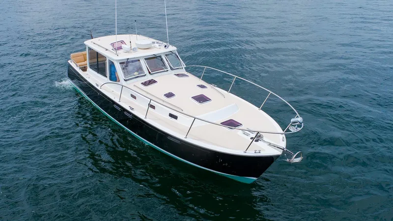 Slide: The Image of 2012 MJM 40z Downeast boat cruising on open water. - 1