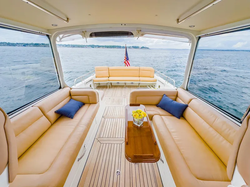Slide: The Image of Luxurious 2012 MJM 40z Downeast yacht interior with tan seating and ocean view. - 16