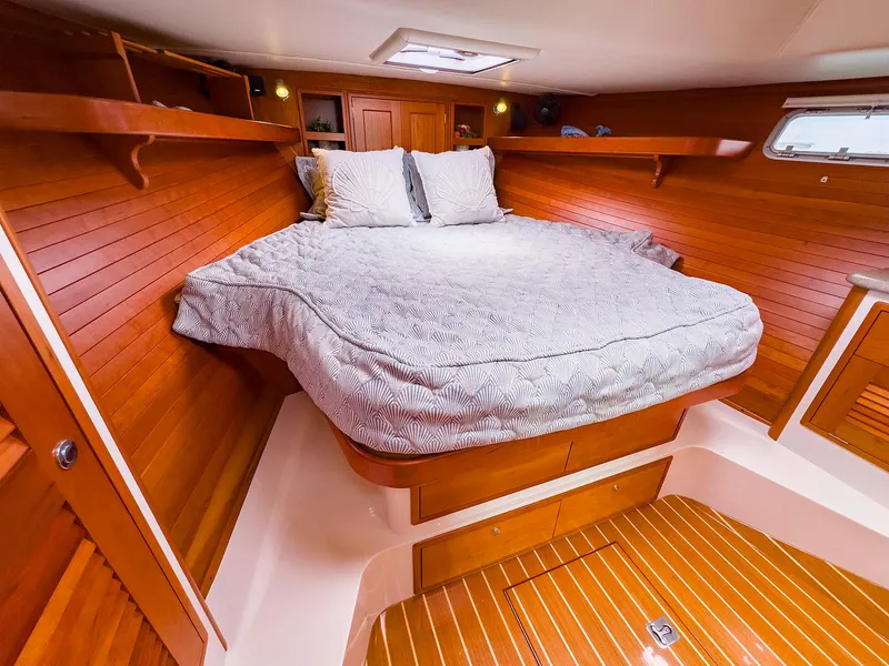 Slide: The Image of Luxurious cabin interior of 2012 MJM 40z Downeast yacht with wooden finish and cozy bedding. - 34