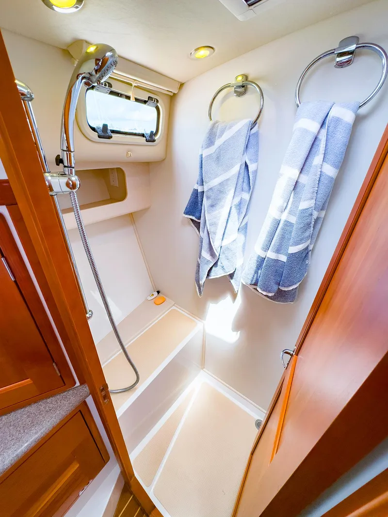 Slide: The Image of 2012 MJM 40z Downeast yacht shower with towels and wooden accents. - 38
