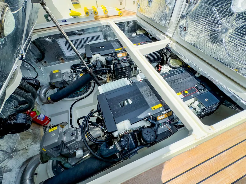 Slide: The Image of Engine compartment of a 2012 MJM 40z Downeast boat, showcasing dual engines. - 39