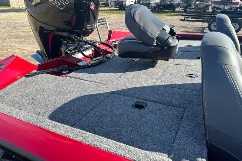 Slide: The Image of 2024 Tracker Pro Team 195 TXW Tournament Edition boat interior with seating and motor. - 16