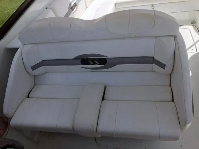 Slide: The Image of 2008 Formula 310 Sun Sport boat interior with white cushioned seating. - 14