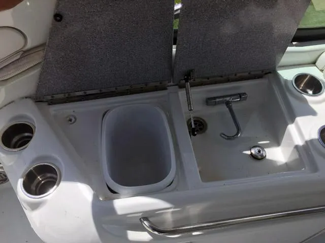 Slide: The Image of 2008 Formula 310 Sun Sport boat sink and countertop with cup holders. - 15