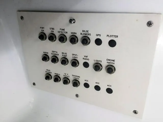 Slide: The Image of Control panel of a 2008 Formula 310 Sun Sport boat with labeled switches. - 20