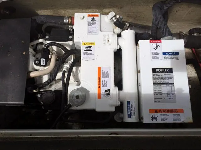 Slide: The Image of Engine compartment of a 2008 Formula 310 Sun Sport boat with Kohler generator. - 24