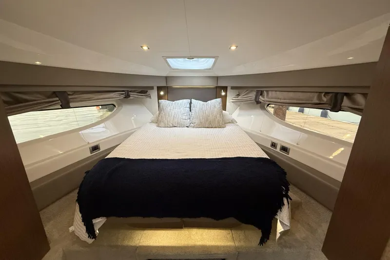 Slide: The Image of Luxurious 2018 Sea Ray Sundancer 460 yacht bedroom with elegant bedding and ambient lighting. - 12