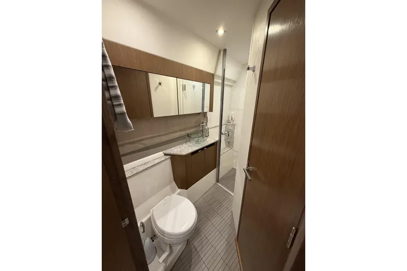 Slide: The Image of Luxurious bathroom in 2018 Sea Ray Sundancer 460 yacht, featuring modern fixtures and elegant design. - 15