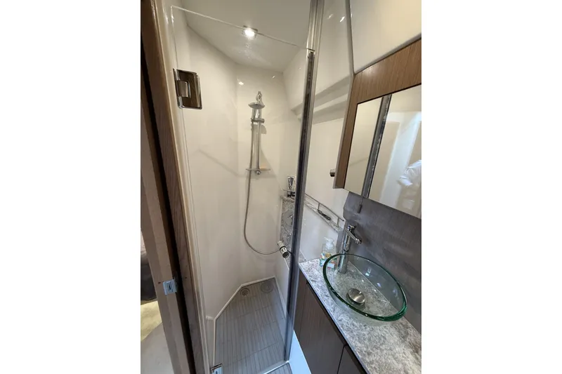 Slide: The Image of Luxurious bathroom in 2018 Sea Ray Sundancer 460 yacht with glass sink and modern shower. - 17