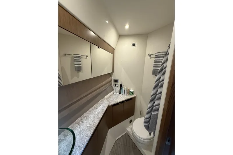 Slide: The Image of Luxurious bathroom in 2018 Sea Ray Sundancer 460 yacht with modern fixtures and elegant design. - 18