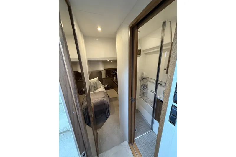 Slide: The Image of Interior of 2018 Sea Ray Sundancer 460 yacht, featuring a cozy cabin and modern bathroom. - 19