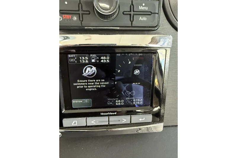 Slide: The Image of 2018 Sea Ray Sundancer 460 dashboard display showing engine and fuel information. - 27