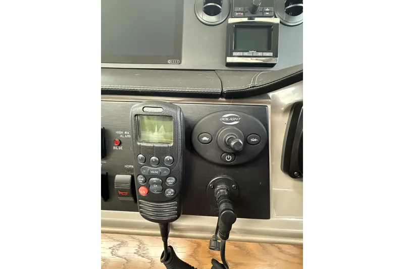 Slide: The Image of Control panel of a 2018 Sea Ray Sundancer 460 yacht with communication devices. - 29