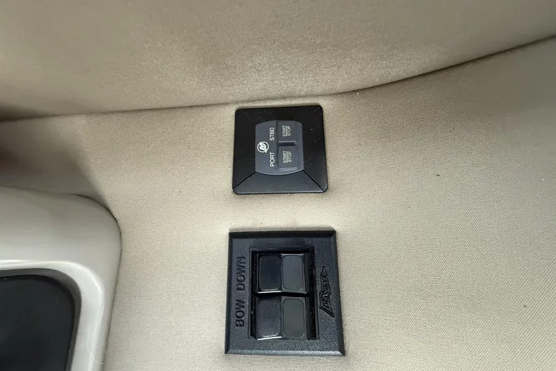 Slide: The Image of Control panel of a 2018 Sea Ray Sundancer 460 boat, featuring port and starboard switches. - 31