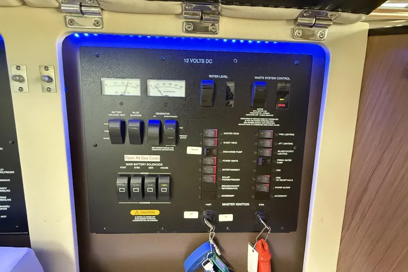 Slide: The Image of Control panel of a 2018 Sea Ray Sundancer 460 yacht with switches and indicators. - 33