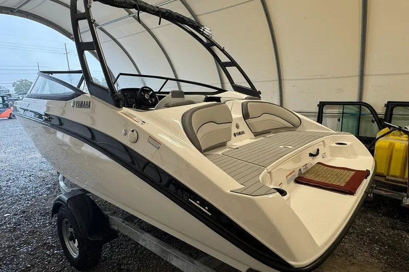 Slide: The Image of 2026 Yamaha AR190 boat in storage, sleek design, white and black color scheme. - 3