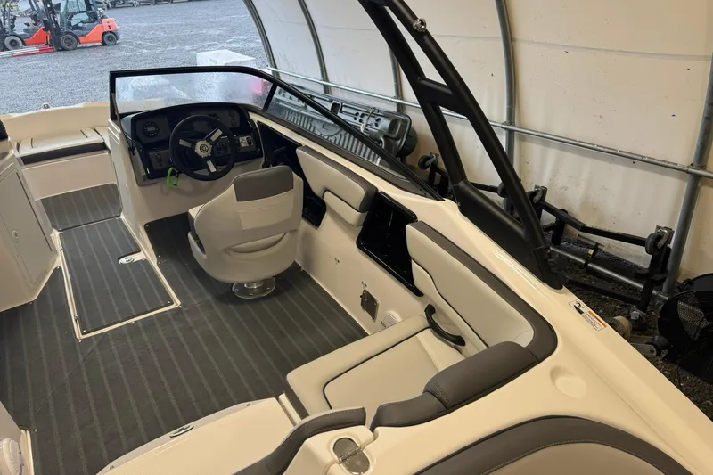 Slide: The Image of 2026 Yamaha Boats AR190 interior with steering wheel and captain's chair. - 9