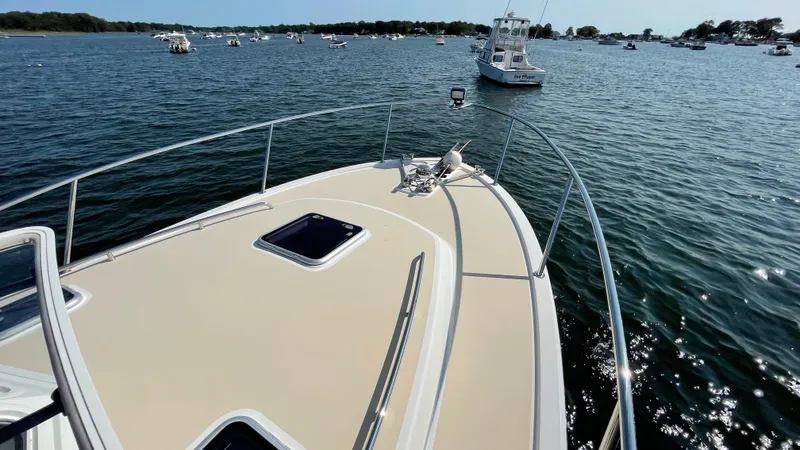 Slide: The Image of Bow view of 2020 MJM 35z yacht on a sunny day, surrounded by boats. - 14