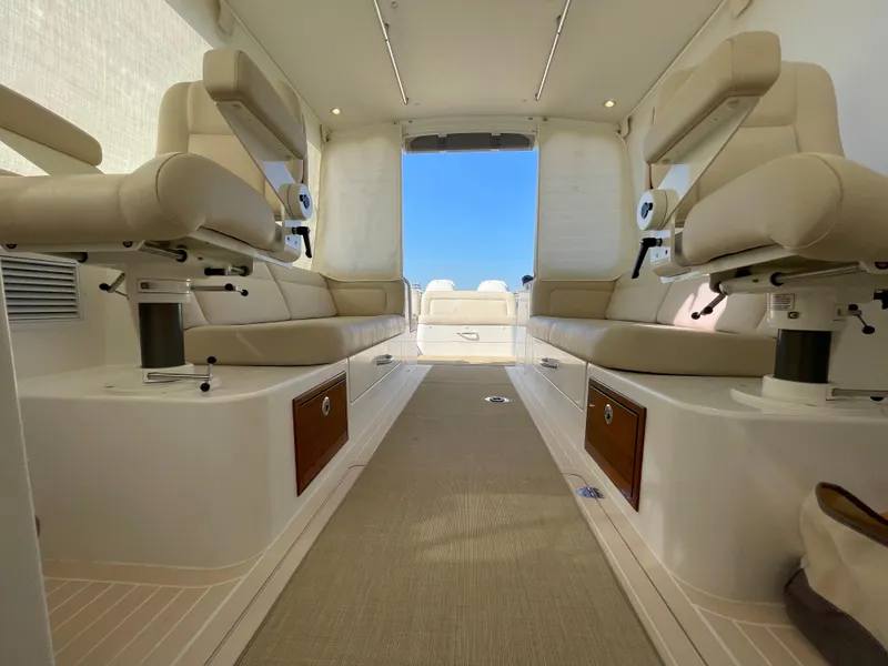 Slide: The Image of Luxurious interior of 2020 MJM 35z boat with beige seating and wooden accents. - 25