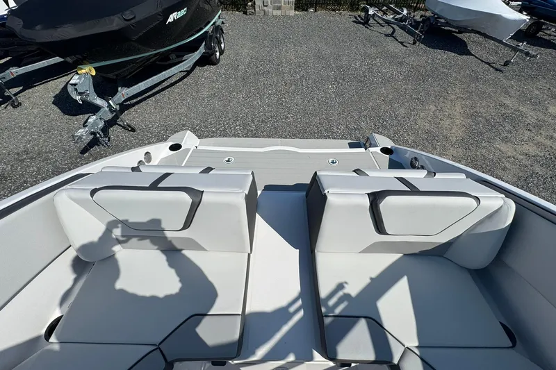 Slide: The Image of 2026 Yamaha Boats AR220 interior with sleek seating and modern steering console. - 11