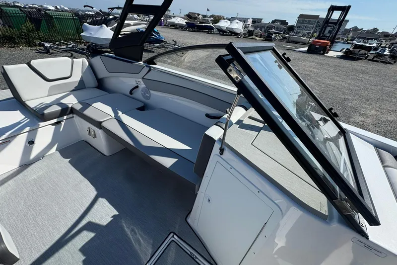 Slide: The Image of 2026 Yamaha Boats AR220 cockpit with steering wheel and modern controls. - 13