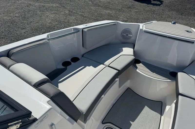 Slide: The Image of Manufacturer Provided Image: 2026 Yamaha Boats AR220 cruising at sunset with wakeboards on rack. - 9