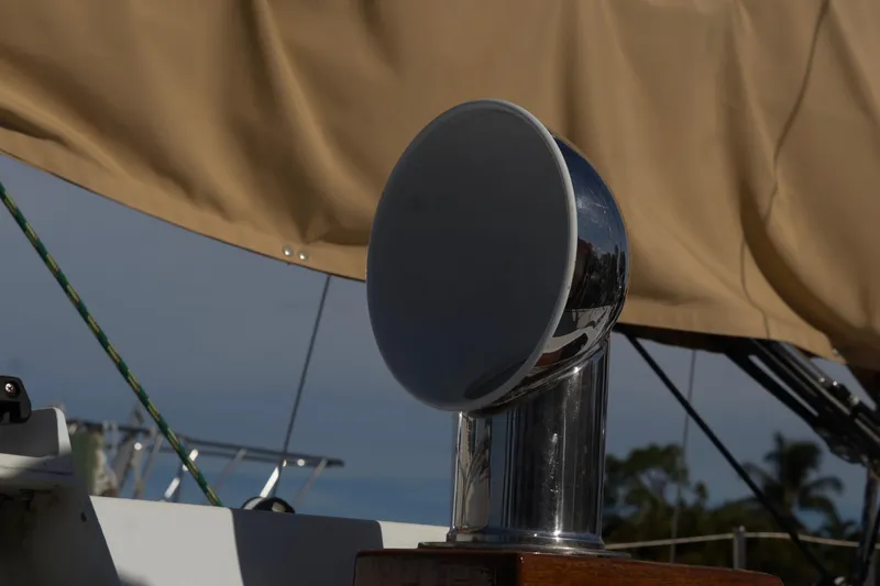 Slide: The Image of Chrome vent on 1980 C&C Landfall 38 sailboat with beige sail background. - 10