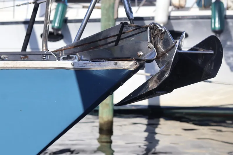 Slide: The Image of Bow of 1980 C&C Landfall 38 sailboat with anchor, docked in marina. - 15
