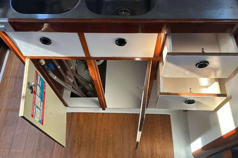 Slide: The Image of Interior view of 1980 C&C Landfall 38 sailboat kitchen cabinets and drawers. - 30