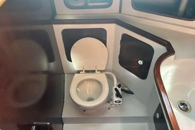 Slide: The Image of Interior of 1980 C&C Landfall 38 sailboat bathroom with toilet and sink. - 36