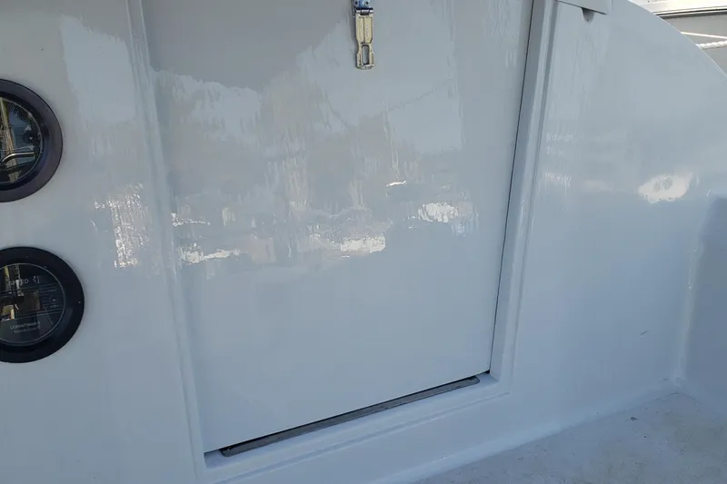 Slide: The Image of White interior of a 1980 C&C Landfall 38 sailboat with gauges and a hatch. - 4