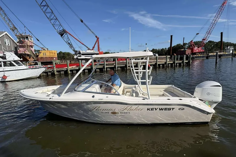 The Image of 2020 Key West 239 DFS boat docked near cranes and waterfront buildings. - 1